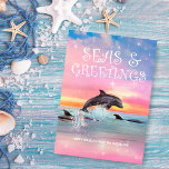 Dolphin Seas & Greetings Beach Christmas Julkort<br><div class="desc">Beach theme Christmas card features a dolphin leaping under a magical,  starry sky with a "Seas & Greetings" caption. Art by KL Stock</div>
