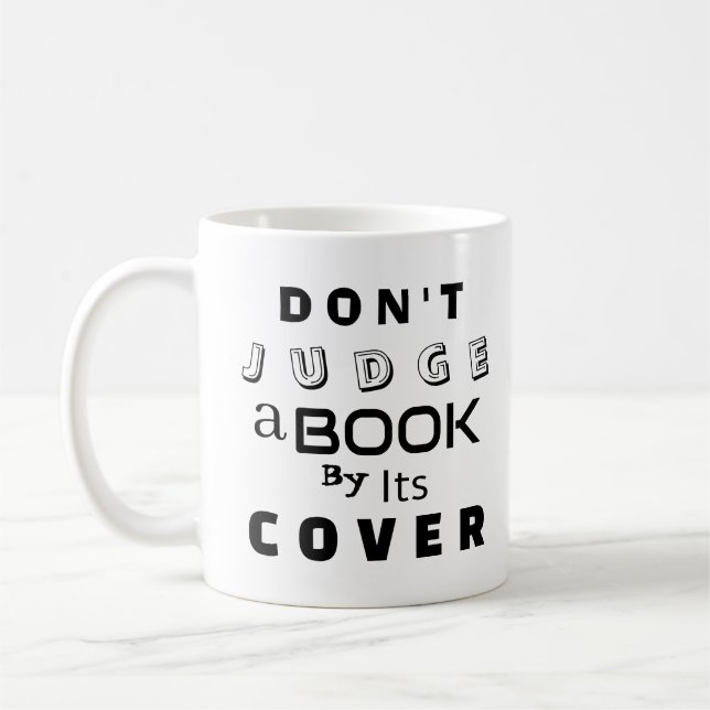 "Doma inte en Bok vid dess omslag" Kaffemugg (Vänster)