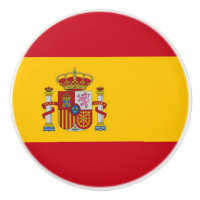 Drag av keramiskt knapp med flagga av Spanien