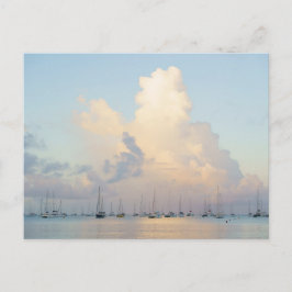 Dreamy pastel sunrise over bay and sailing boats vykort