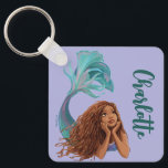 Dreamy Sjöjungfru Ariel Art Nyckelring<br><div class="desc">Dö in i havets magi med den här fantastiska illustrationen av Ariel från Disneys lilla Sjöjungfru! Med en vackert utförlig återgivning av den äventyrliga sjöjungfrun fångar den här konstverket hennes och nyfikenhet med blommande hår, mousserande havsaccenter och ett glatt snurrande svan. Perfekt för att lägga till en stänk havscharm till...</div>