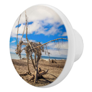 Driftwood-grafik på Hokitika Beach, Nya Zeeland Knopp
