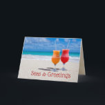 Drinks Beach-julhavet i Hälsning-vikt Kort<br><div class="desc">Seas och hälsning, två drycker på stranden, varma julhälsningskort. Fruktiga, frysta cocktails sitter på en solstrand med tropiskt blått vatten vid horisonten. Använda in kortet det provmeddelande som vill att mottagaren "varma och mysiga julminnen", eller byt ut det mot ditt eget hälsning. Lägg till en namnteckning eller lämna tom om...</div>