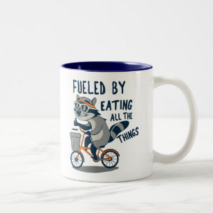 Drivs av att äta all Sak Racoon Cycling Två-Tonad Mugg