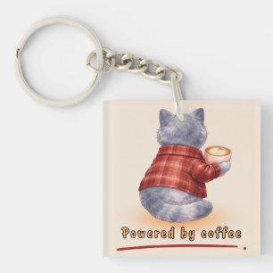 "Drivs av kaffe" Katt som håller en kopp kaffe