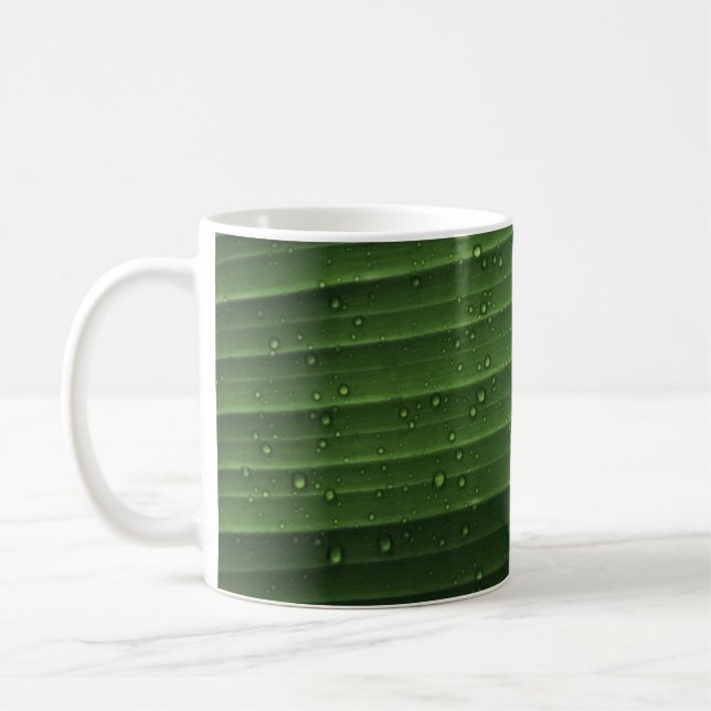 droppar i vatten på grönt löv kaffemugg (Vänster)