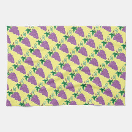 Druvagrupp på gult matcha kökshandduk