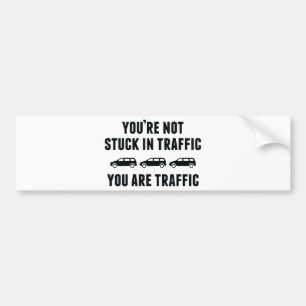 Du är inte upptagen med trafiken. Du är trafik. Bildekal