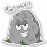 Du Sten! Funny Grått Tecknad Stone Klistermärken<br><div class="desc">Lustigt grått tecknad sten med halvstängt öga och ett stort toftigt leende. Han vilar på lite frisk gräs i grönten och ord "Du Sten!" i mörk grått brev över stenens ovansida.</div>