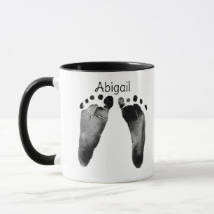 Dubbla fotavtryck i Baby Mugg