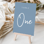 Dusty Blue Hand Scripted Bord ONE Bordsnummer<br><div class="desc">Enkla kort och kort för bordsnummer i chic i dammig, blått och vitt, gör en elegant påstående vid bröllop eller vid evenemanget. Designfunktionerna "bord [nummer]" i en ögonetsande blandning av klassisk serif och handskriven skriptskrift. Utformningen upprepas på båda sidor. Individuellt numrerade kort som säljs separat. Beställ varje bordsnummer var för...</div>