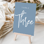 Dusty Blue Hand Scripted Bord THREE Bordsnummer<br><div class="desc">Enkla kort för bordsnummer och chic i Dusty Blue och White gör en elegant påstående vid din bröllop eller händelse. Designfunktionerna "bord [nummer]" i en ögonetsande blandning av klassisk serif och handskriven skriptskrift. Utformningen upprepas på båda sidor. Individuellt numrerade kort som säljs separat. Beställ varje bordsnummer var för sig från...</div>