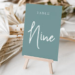 Dusty Teal Hand Scripted Bord NINE Bordsnummer<br><div class="desc">Enkla kort för bordsnummer och chic i dammig teal aqua och vit gör en elegant påstående vid din bröllop eller händelse. Designfunktionerna "bord [nummer]" i en ögonetsande blandning av klassisk serif och handskriven skriptskrift. Utformningen upprepas på båda sidor. Individuellt numrerade kort som säljs separat. Beställ varje bordsnummer var för sig...</div>