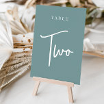 Dusty Teal Hand Scripted Bord TWO Bordsnummer<br><div class="desc">Enkla kort för bordsnummer och chic i dammig teal aqua och vit gör en elegant påstående vid din bröllop eller händelse. Designfunktionerna "bord [nummer]" i en ögonetsande blandning av klassisk serif och handskriven skriptskrift. Utformningen upprepas på båda sidor. Individuellt numrerade kort som säljs separat. Beställ varje bordsnummer var för sig...</div>