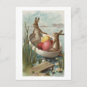 EasterBunnies i ett fartyg med kulöra ägg Helg Vykort
