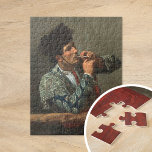 Efter Bullmatch | Mary Cassatt Pussel<br><div class="desc">Efter Bullmatch (1873) av Mary Cassatt visar en slående porträtt på en tjurfäktare som vilar efter sin kamp, och som då och då röker en cigarett. Målningen fångar kärnan i bullrigerns karisma och det tysta reflekterande ögonblicket efter arenans intensitet. Kassatens detaljerade penselarbete och ljusets använda understryker figur uttryck och attityder...</div>