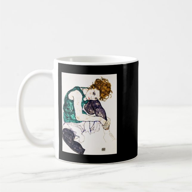 Egon Schiele har med Bent Knees sittande kvinna Kaffemugg (Vänster)