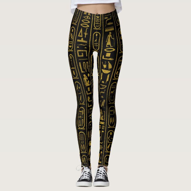 Egyptiska forntida guld- hieroglyphs på svart leggings (Framsida)