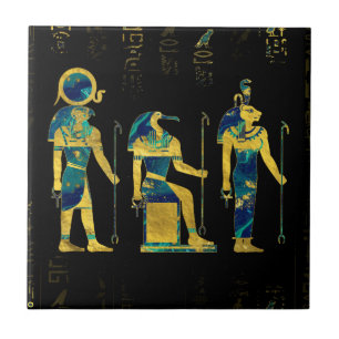 Egyptiska gudomar på guld- hieroglyphics och kakelplatta