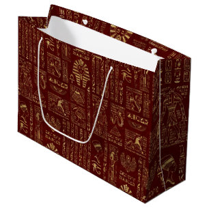 Egyptiska hieroglyphs och symboler på rött läde