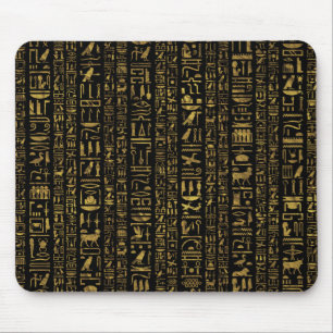 Egyptiskt hieroglyphsvintageguld på svart musmatta