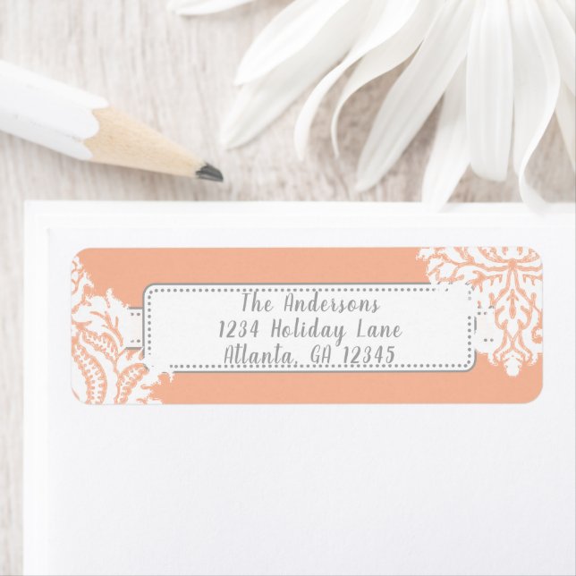 Eldborre på korall med rött returadress etikett (Insitu)