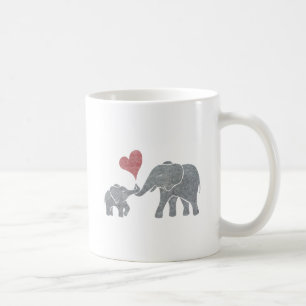 Elefantkramar grånar mamman och babyen med röd kaffemugg