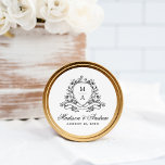 Elegant Black Blommigt Vapensköld Monogram Bröllop Runt Klistermärke<br><div class="desc">Lägg till en förfinad avslutande beröring till bröllop med dessa monogramklistermärken för svart blommigt i eleganten, som innehåller parets initialer som är inramad av en tidlös, svart botanisk design. Personlig med namn och bröllop-datumet i en fantastisk kalligrafi är dessa klistermärken perfekt för försegling av höljen, dekorering av favoritpåsar eller utökning...</div>