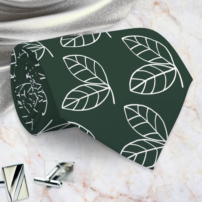 Elegant bladsmönster mörkgrön slips (A dark green tie with a pattern of white line-art leaves in a modern style)