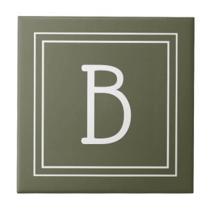 Elegant bokstav med rustic grön och vit monogram kakelplatta