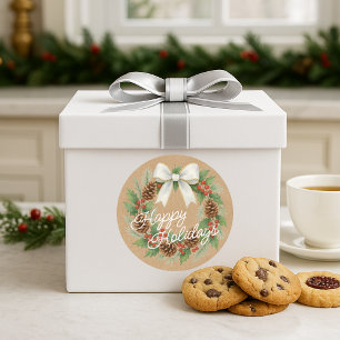Elegant decemberkrans med vit rosett i akvarell runt klistermärke