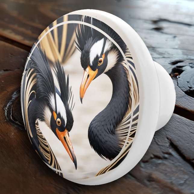 Elegant Deco Romantiska Tranor Knopp (An elegant ceramic door knob featuring an illustration of two romantic cranes in deco style)