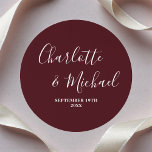 Elegant Deep Burgundy Script Minimalist Wedding Runt Klistermärke<br><div class="desc">Make your wedding invitations stand out with our Elegant Deep Burgundy Script Minimalist Wedding Sticker. Customized with the names of the bride and groom,  along with the special date,  these stickers add a touch of sophistication to your big day.</div>