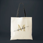 Elegant guld- och svart personlig monogram tygkasse<br><div class="desc">Klassisk feminint minimalistisk och elegant toteväska. Denna design har ett enkelt och modernt guld- och svart skriptmonogram. Du kan anpassa med en initial och namn i skrivstil. Denna toteväska kommer att vara en perfekt personlig gåva för bröllopspart - brudtjänst,  brudtärnor,  brudens och brudgummens mödrar och blomsterflicka.</div>
