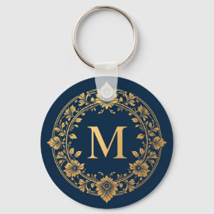 Elegant guldblommig monogramdesign nyckelring