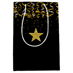 Elegant guldstjärna och konfekt på svart