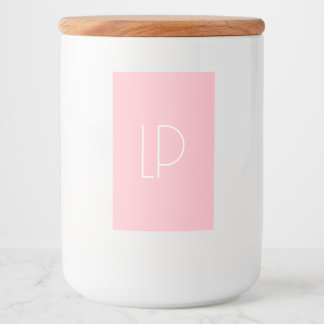 Elegant minimalistisk modern initial på pastellros mat etikett