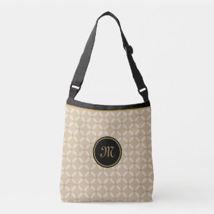 Elegant monogram på svart, beige och guld axelväska