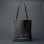 Elegant Monogram Svart Vitt Modern Minimalistisk  Tygkasse<br><div class="desc">Anpassa denna stilrena shoppingbag med din namn initial monogram. Designen har en enkel anpassad monogramdesign i klassisk vit modern minimalistisk typografi på svart bakgrund. Lätt att anpassa. Perfekt som present till alla du älskar. Ta en till dig själv också.</div>