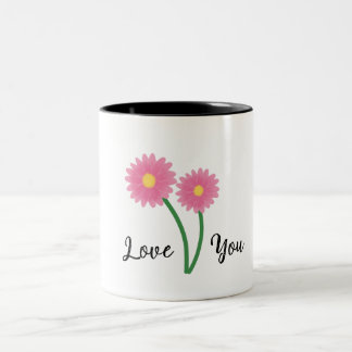 Elegant mugg med blommor av rosa daisy är en vanli