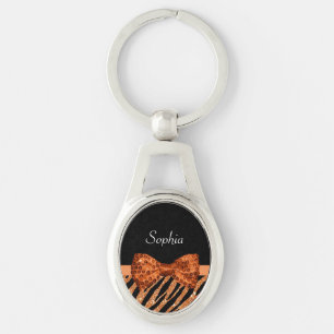 Elegant orange pilbåge och namn för zebra ovalt silverfärgad nyckelring