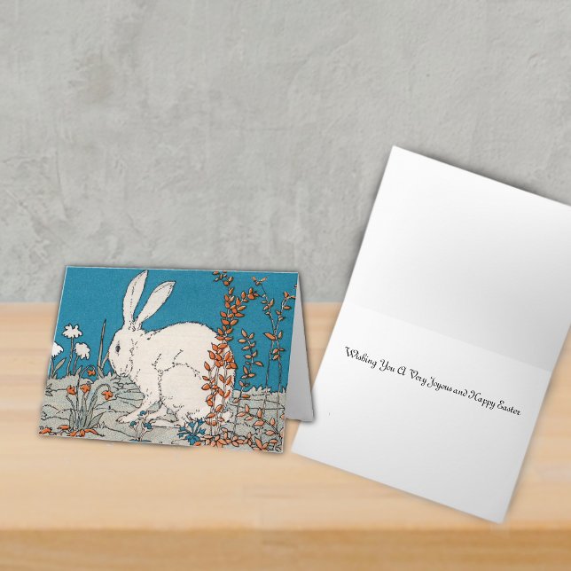 Elegant påsk för vintagevitkanin helgkort (White sitting Easter Rabbit surrounded by flowers on Easter Greeting card.)