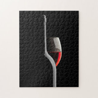 Elegant Red Wine Glass & Bottle. Black Background Pussel