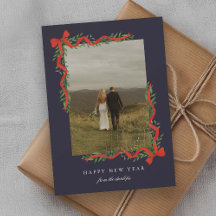 Elegant röd slinga med grönska Foto Nyår