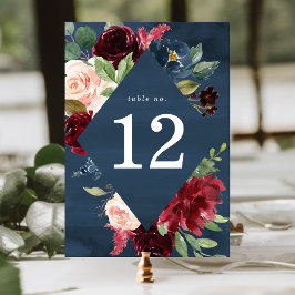 Elegant rosabränd och marinblå blomsterbröllop bordsnummer