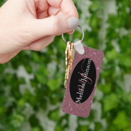 Elegant roséguld bokstavsstil på svart nyckelring