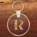 Elegant Rustic Guld & Brown Personlig Monogram Nyckelring<br><div class="desc">Elegantens monogrammerade gåva för manar med rostfritt brunt trä och guld. Om du vill anpassa det gyllene monogrammet klickar du på "Anpassa ytterligare". Alla brev finns i en enda fil som bara behöver flyttat till ställe vid högerna brev i mitten i cirkeln. Klicka sedan på "Klart" och anpassa texten på...</div>