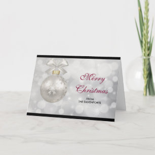 Elegant silver julgranskula mot bokeh-ljus kort