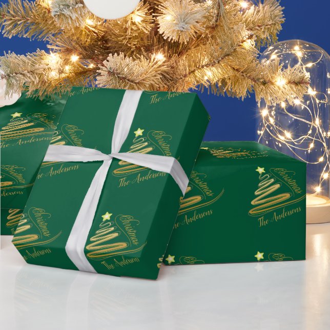 Elegant smaragdgrön julgran med guldblad presentpapper (Helgdagar)