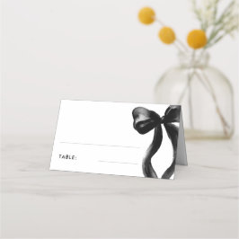 Elegant svart bröllopsduschbord med rosettdekorati placeringskort